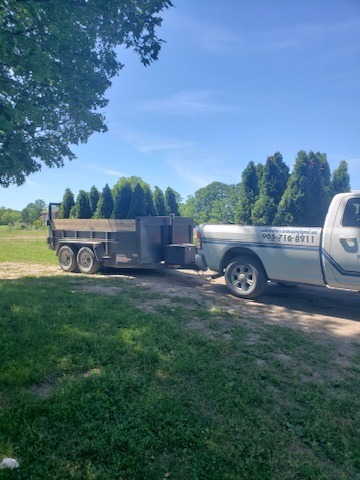 Walker Brothers branded pickup truck and landscape trailer